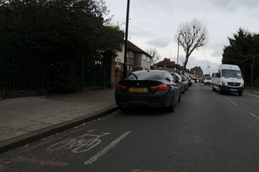 Cars parked in the current Boston Road bike lane